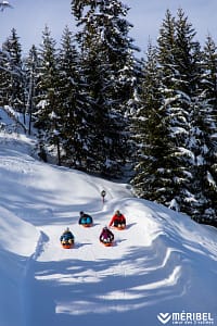 Powder Pines Luxury Travel - Méribel Sledging Through Trees - Photo Credit Sylvain Aymoz